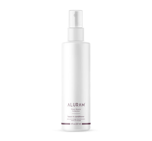 A tall white bottle of ALURAM Leave-In Conditioner with a clear spray top, centered on a solid white background.